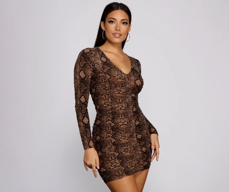 elegant and sophisticated Mimi dresses for a night out on the town.Sultry Ruched Snake Charming Print Mini Dress